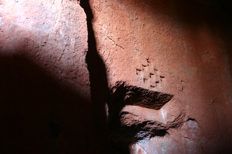 Carving above west door